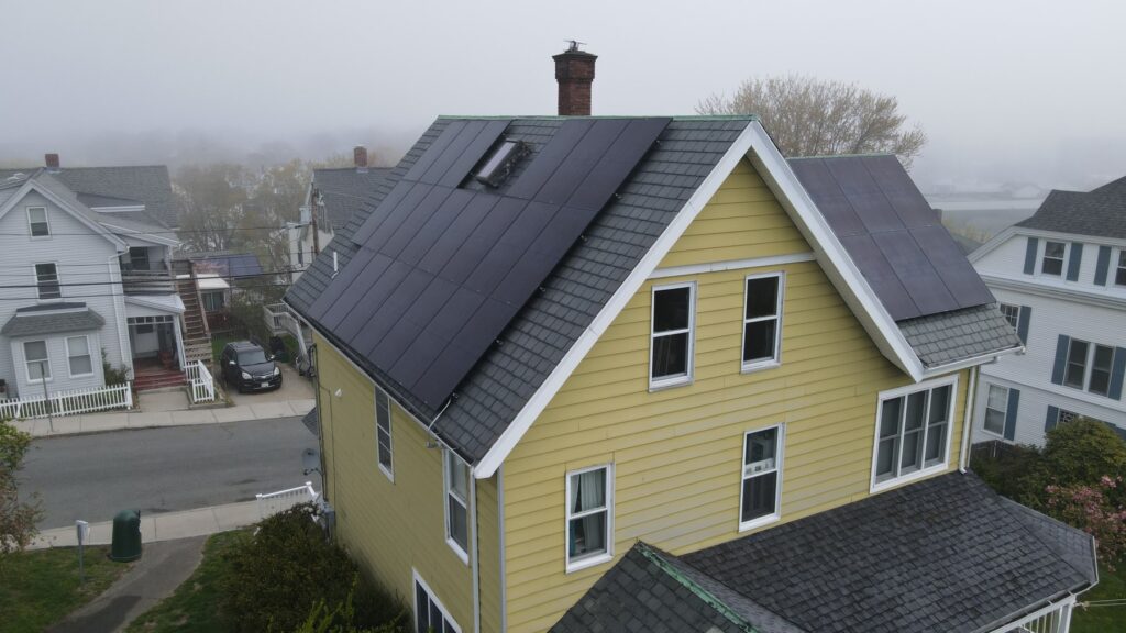 Aerial view of solar panels installed on a slate roof using the SlatePlate mounting system
