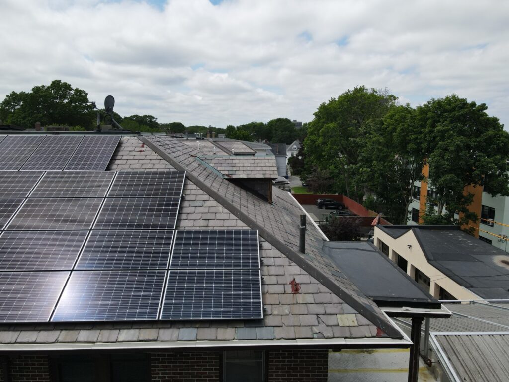 Aerial view of solar panels installed on a slate roof using the SlatePlate mounting system