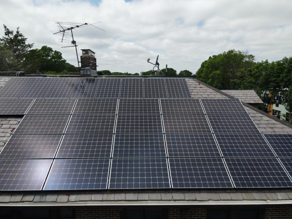 Aerial view of solar panels installed on a slate roof using the SlatePlate mounting system