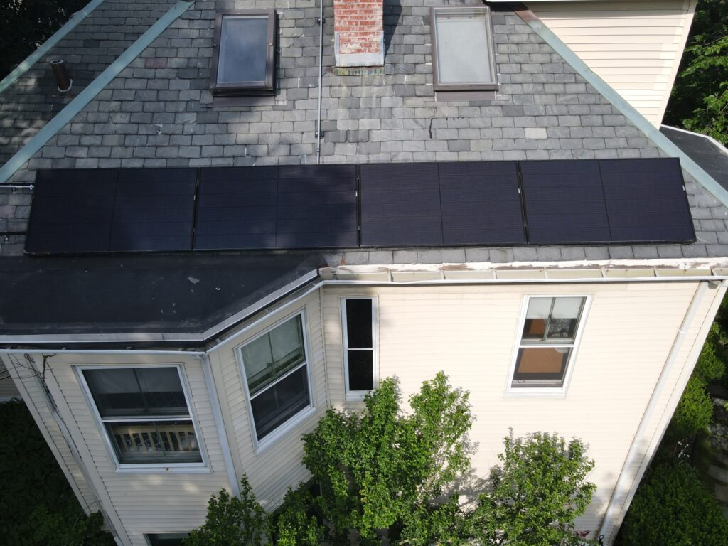 Aerial view of solar panels installed on a slate roof using the SlatePlate mounting system