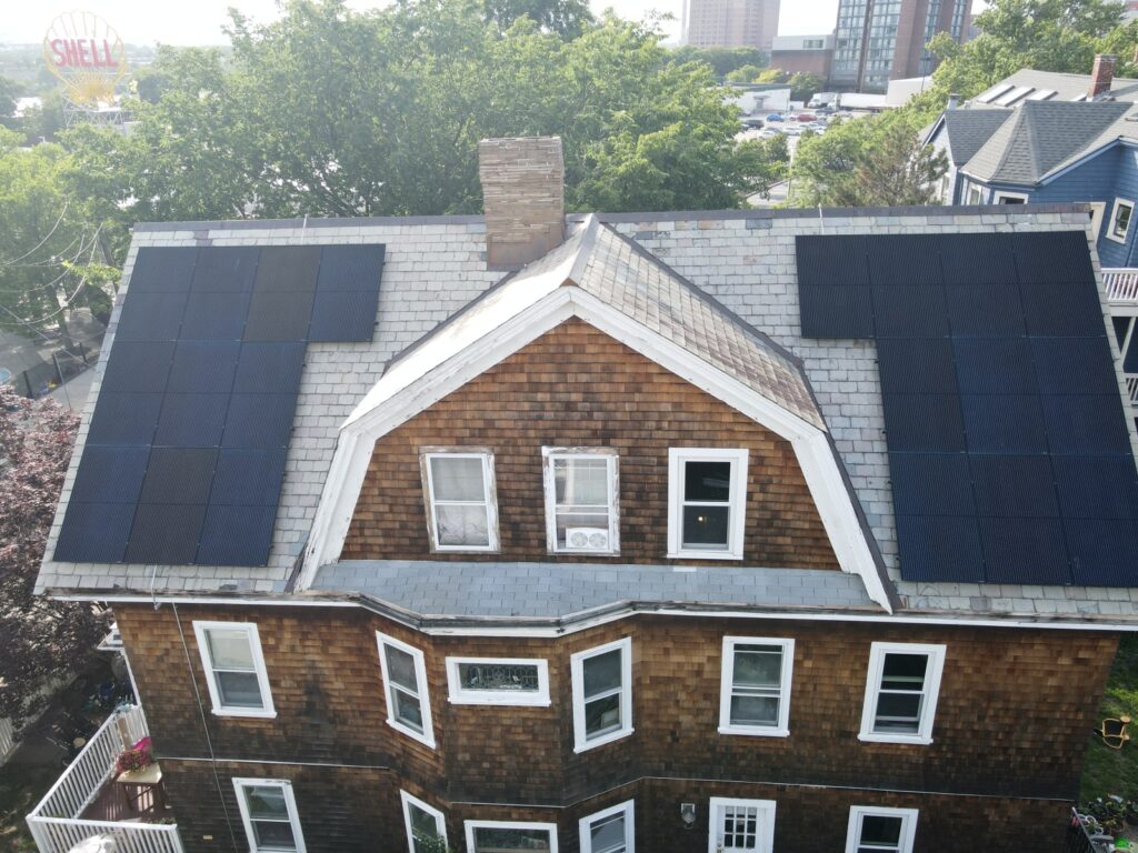 Aerial view of solar panels installed on a slate roof using the SlatePlate mounting system