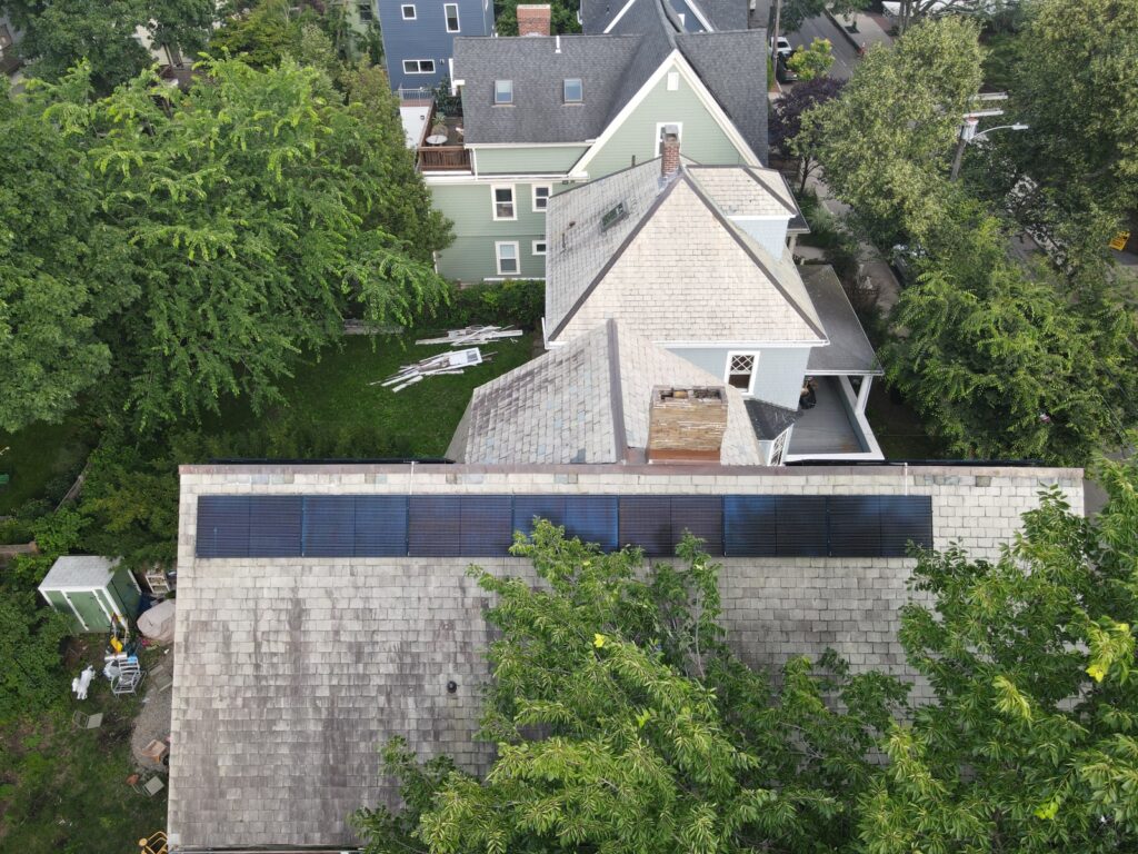 Aerial view of solar panels installed on a slate roof using the SlatePlate mounting system