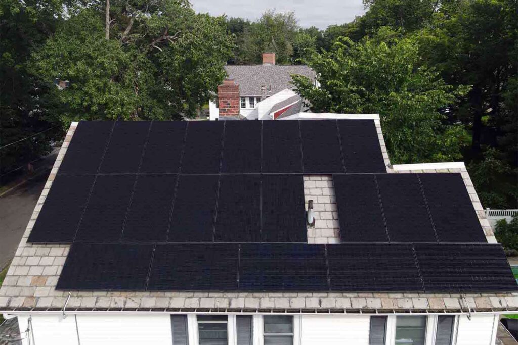 Solar panels mounted on a slate roof with the SlatePlate system, showing the finished installation