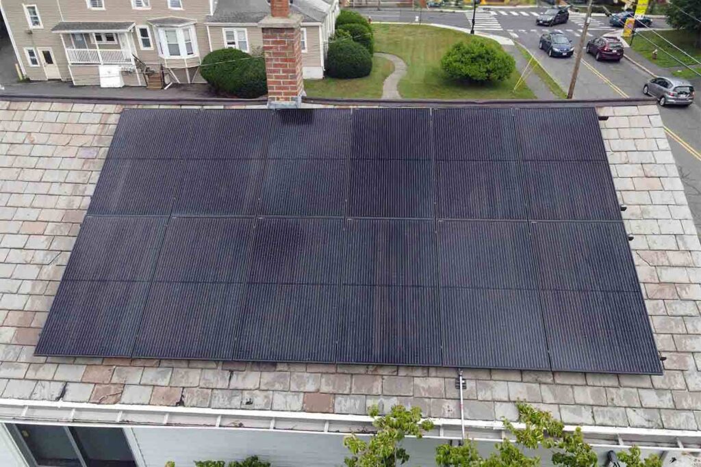 Solar panels mounted on a slate roof with the SlatePlate system, showing the finished installation