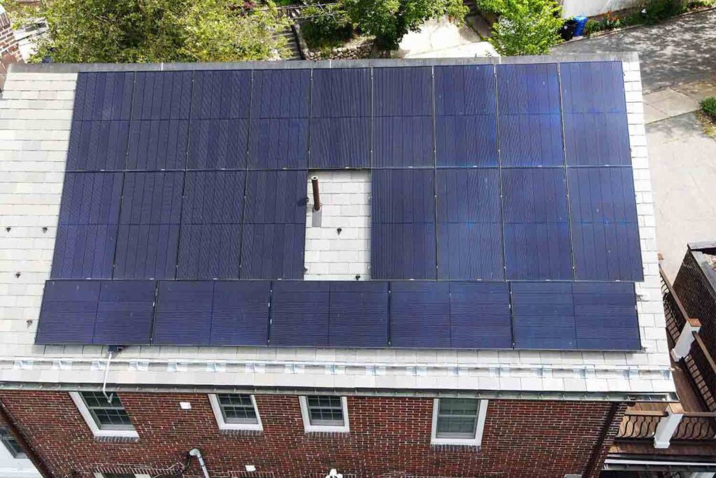 Solar panels mounted on a slate roof with the SlatePlate system, showing the finished installation