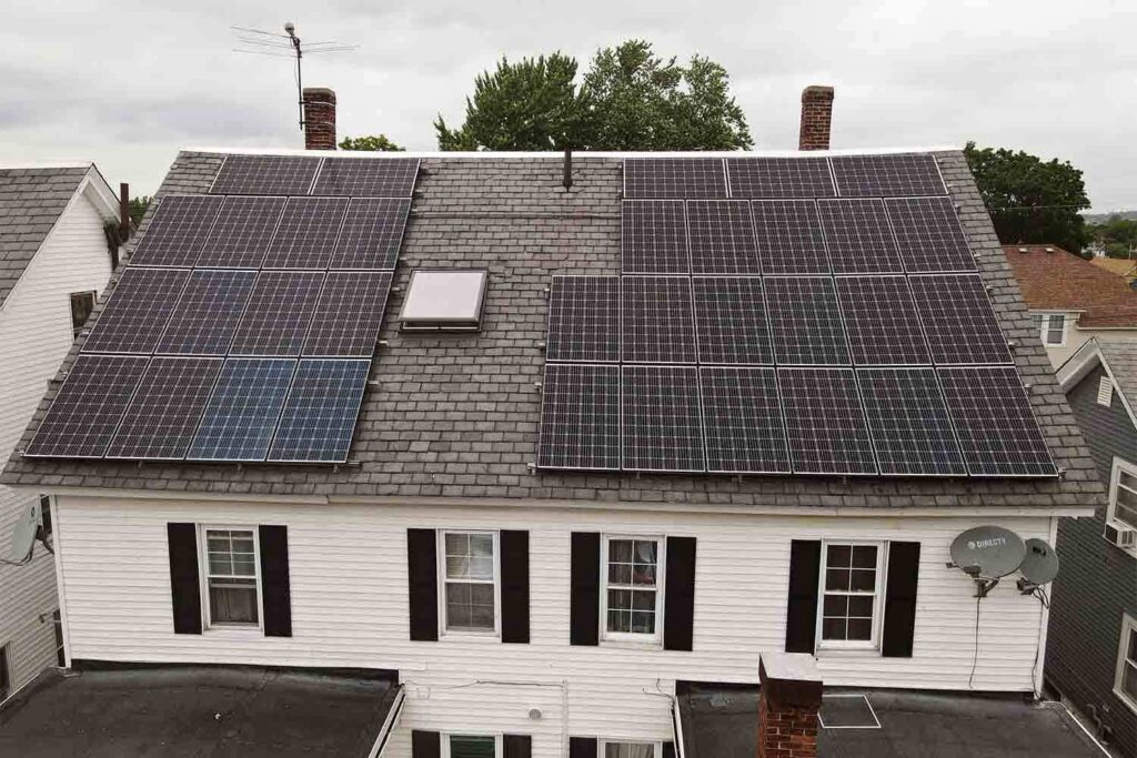 Solar panels mounted on a slate roof with the SlatePlate system, showing the finished installation