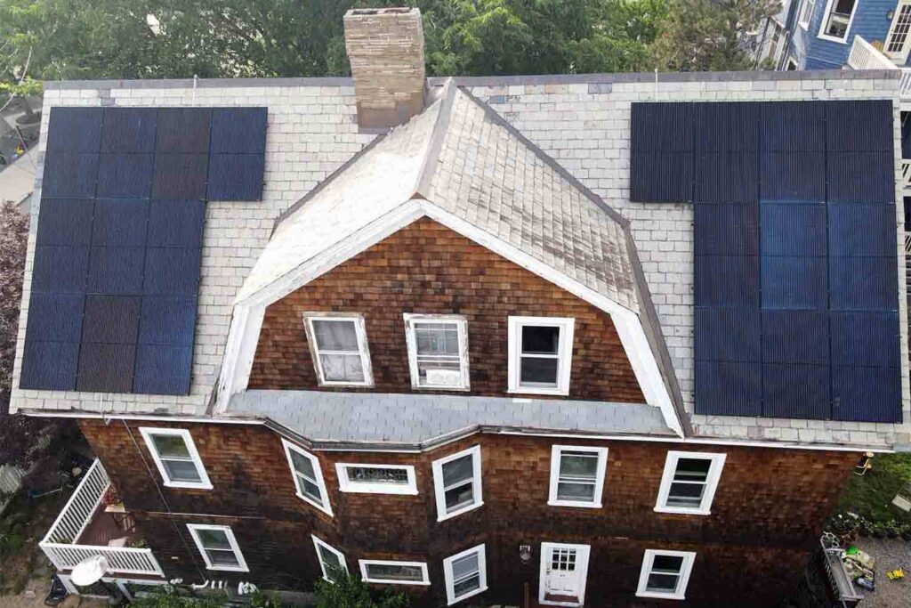 Solar panels mounted on a slate roof with the SlatePlate system, showing the finished installation