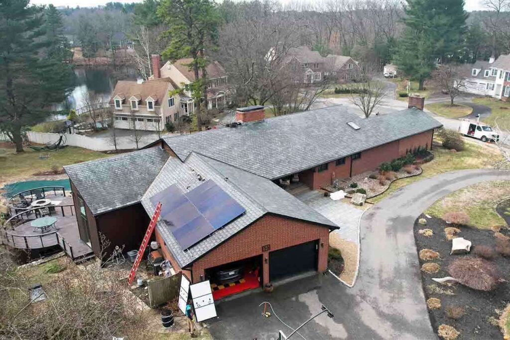 Solar panels mounted on a slate roof with the SlatePlate system, showing the finished installation