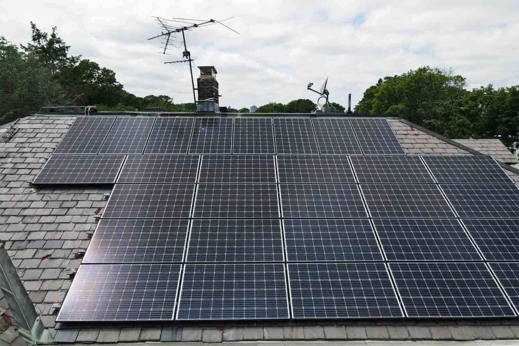 Solar panels mounted on a slate roof with the SlatePlate system, showing the finished installation