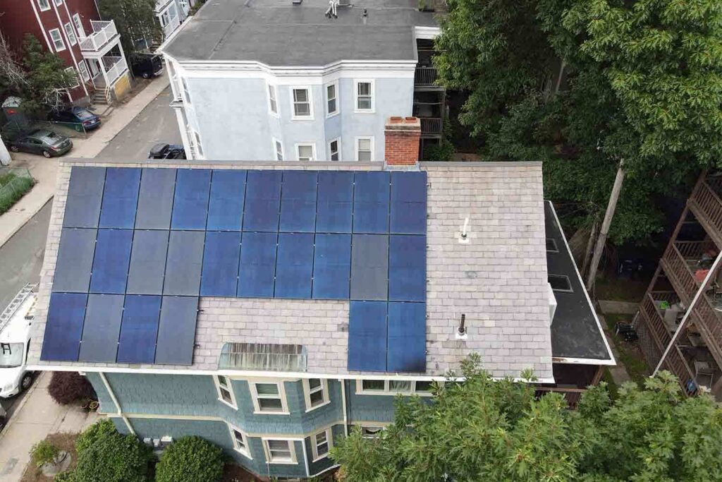 Solar panels mounted on a slate roof with the SlatePlate system, showing the finished installation