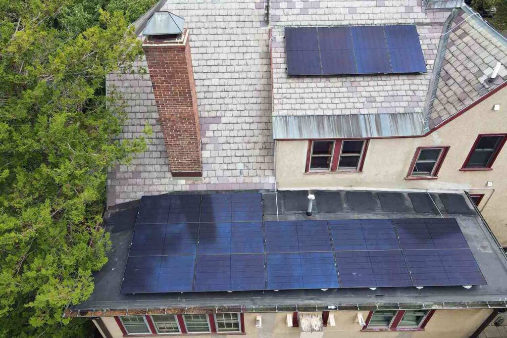 Solar panels mounted on a slate roof with the SlatePlate system, showing the finished installation