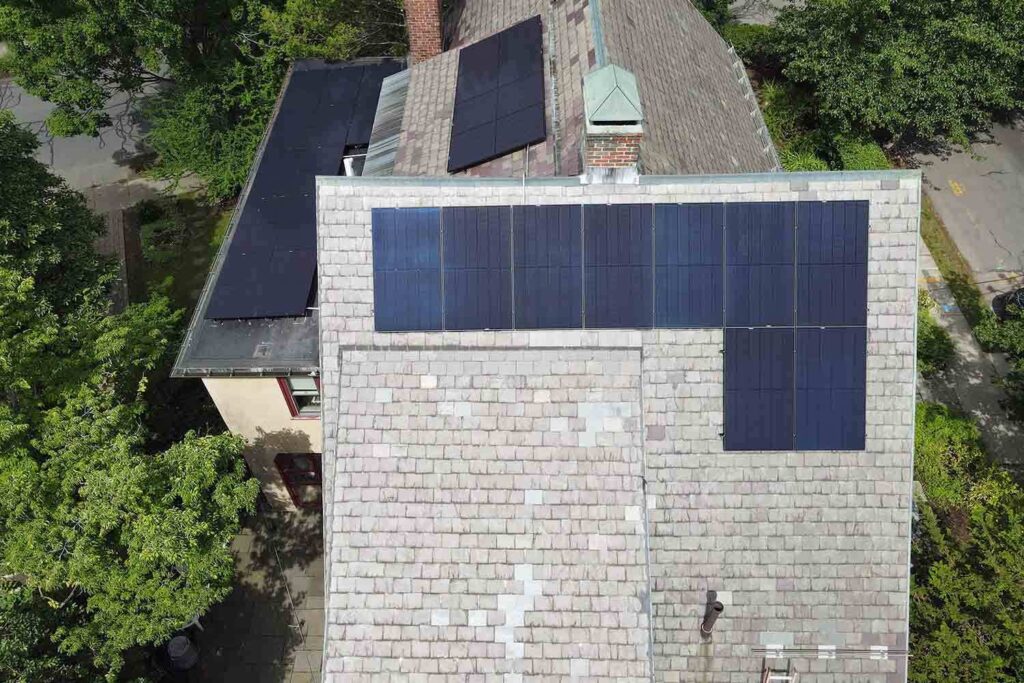 Solar panels mounted on a slate roof with the SlatePlate system, showing the finished installation
