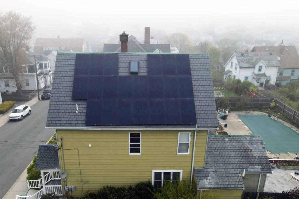 Solar panels mounted on a slate roof with the SlatePlate system, showing the finished installation