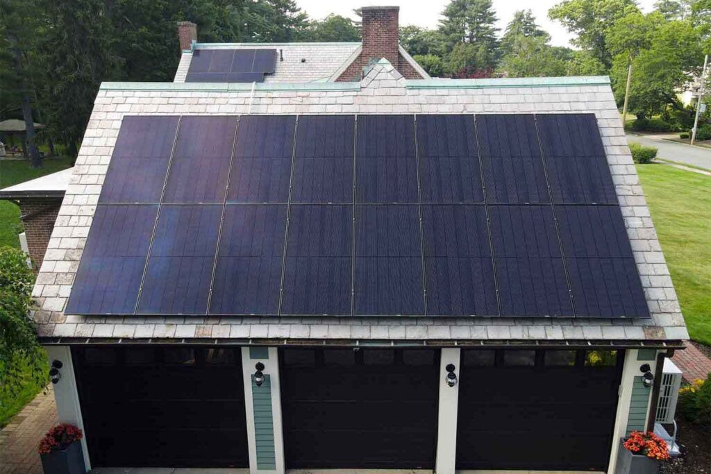 Solar panels mounted on a slate roof with the SlatePlate system, showing the finished installation