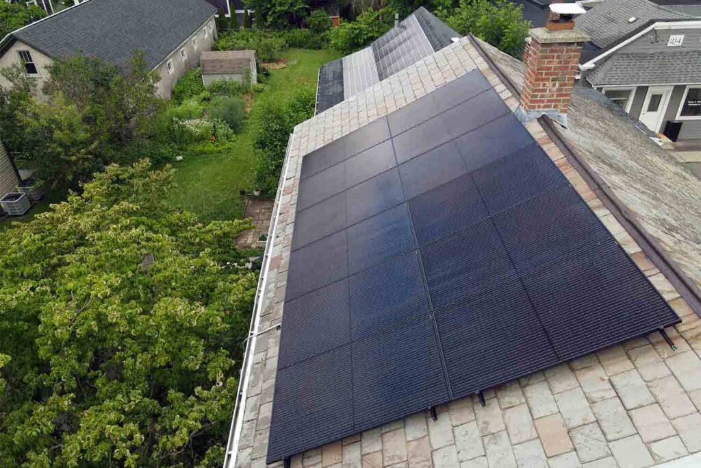 Solar panels mounted on a slate roof with the SlatePlate system, showing the finished installation