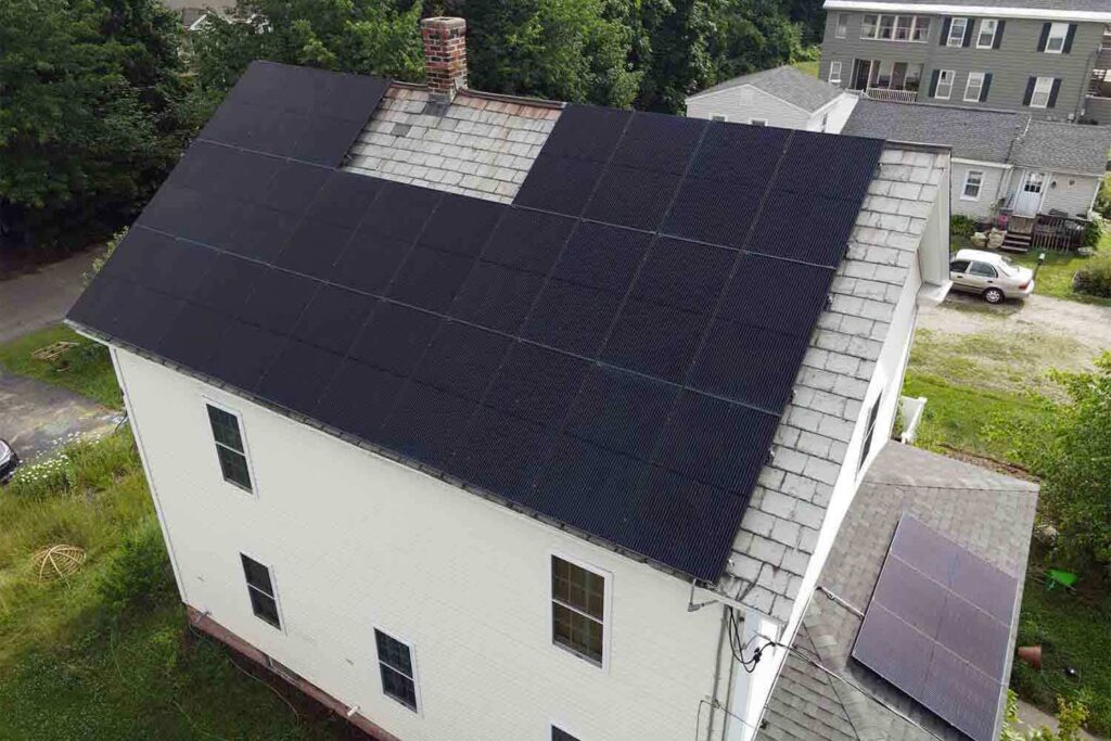Solar panels mounted on a slate roof with the SlatePlate system, showing the finished installation