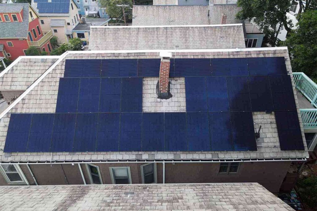 Solar panels mounted on a slate roof with the SlatePlate system, showing the finished installation
